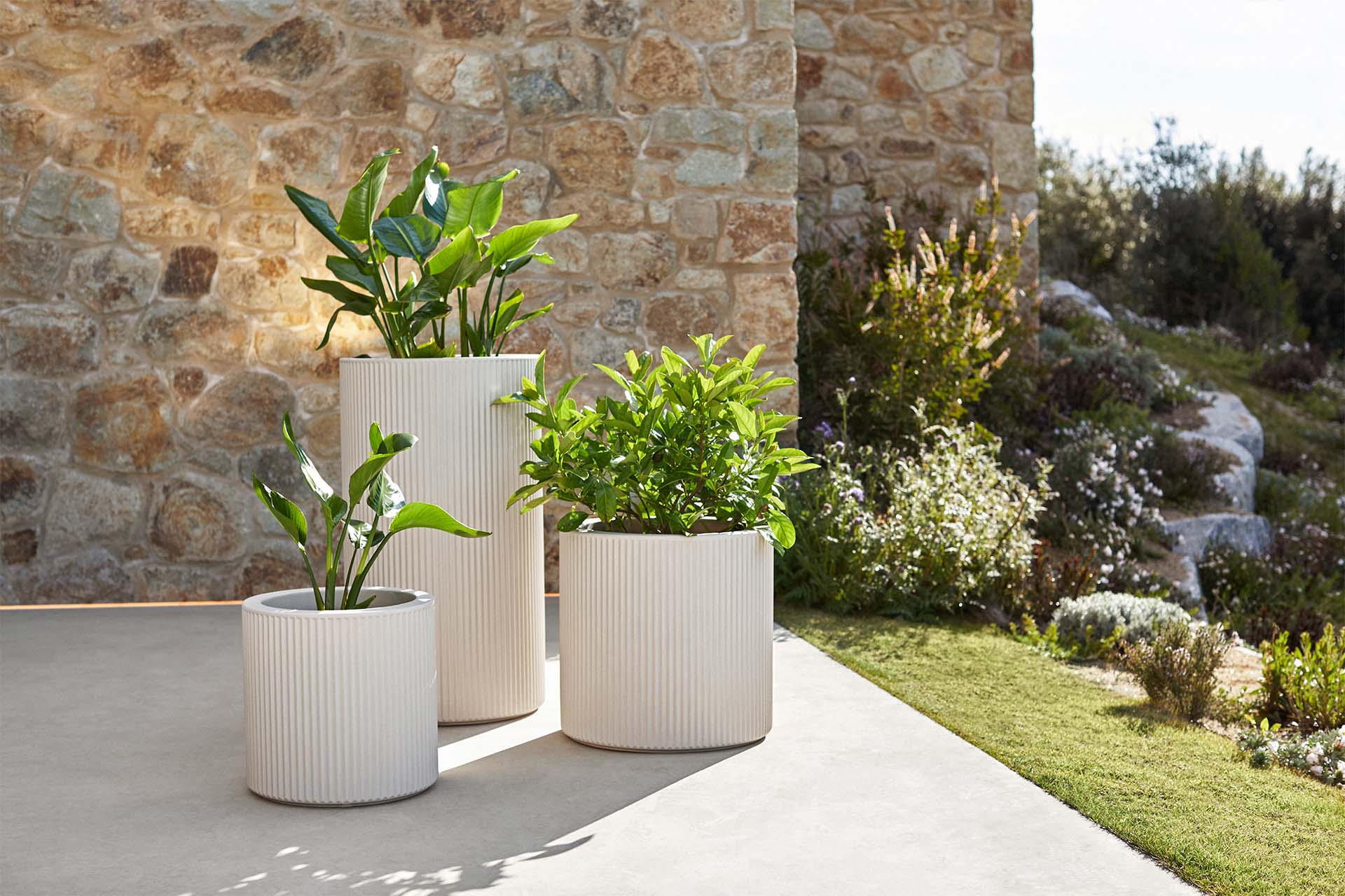 Gatsby modular sofa and planters by Vondom